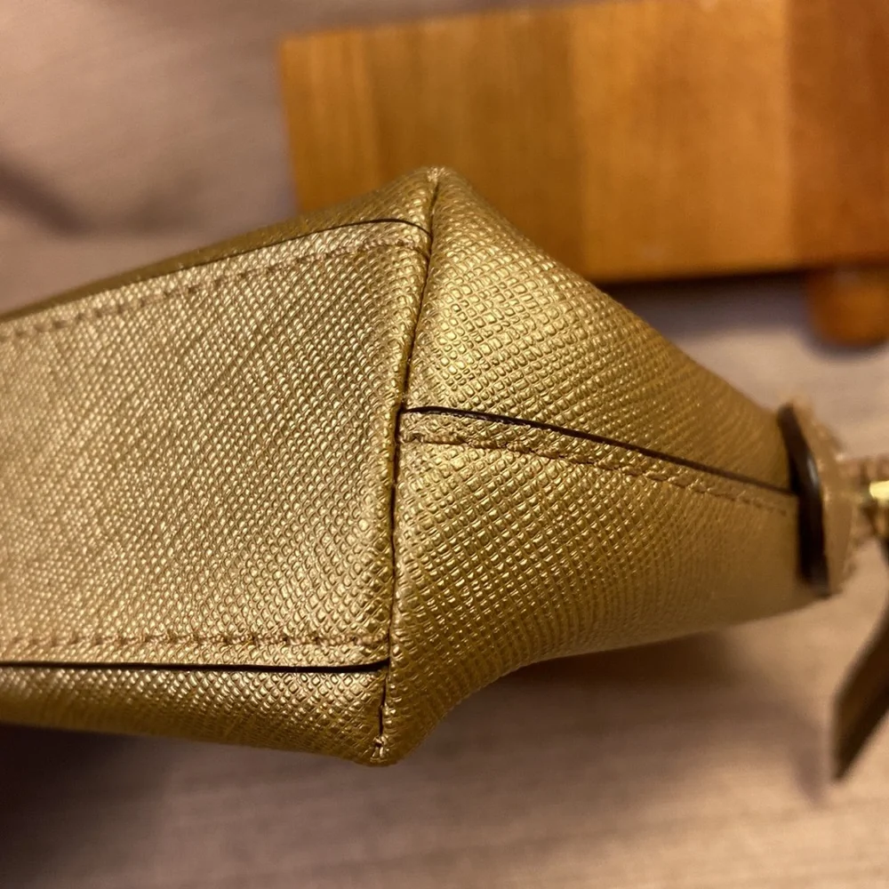 Coach gold metallic color cosmetic pouch w/elegant bow
